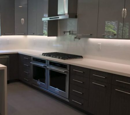 Sleek modern kitchen with double ovens
