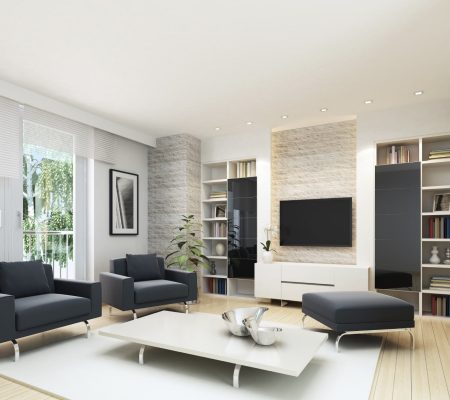 Modern living room with black sofas and TV