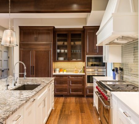 Modern kitchen with granite island and appliances