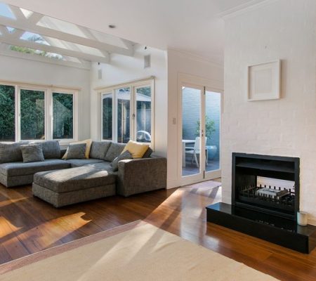 Sunlit modern living room with sectional sofa